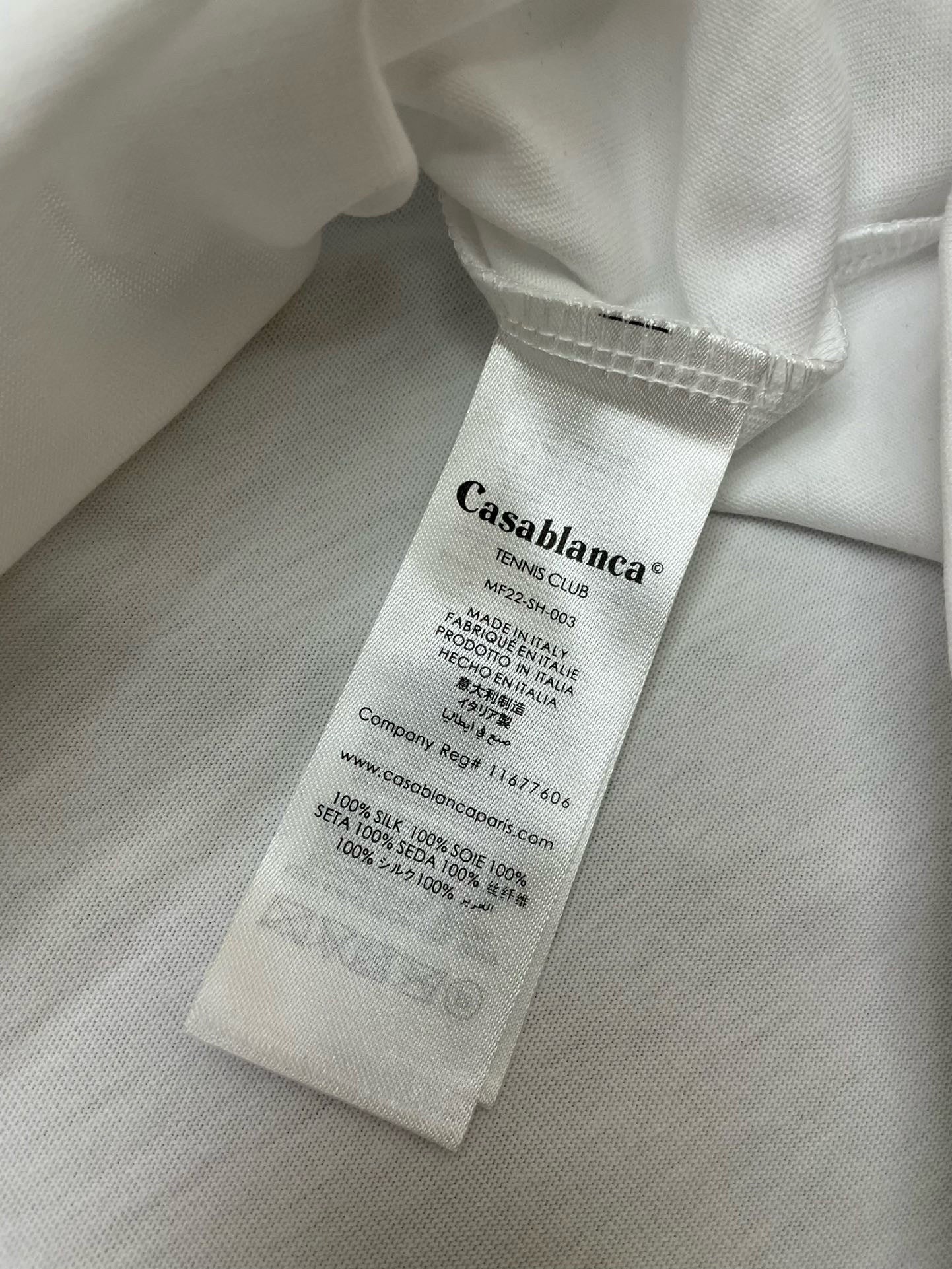 Camiseta blanca, caqui y negra
