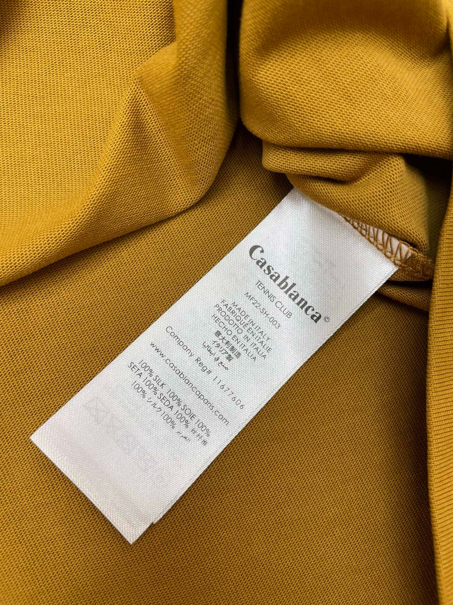 Camiseta blanca, caqui y negra
