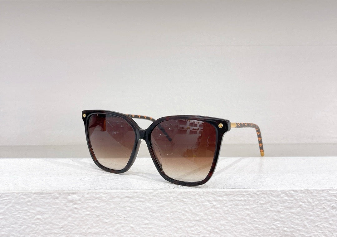 Gafas de sol negras, marrones y blancas