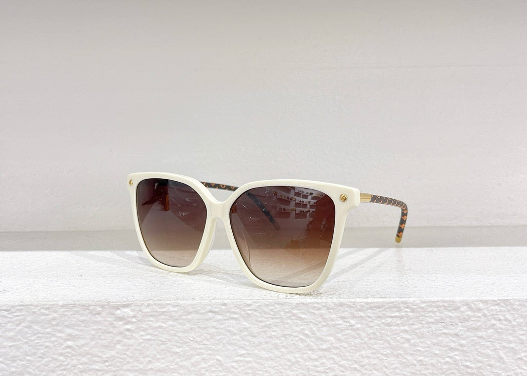 Gafas de sol negras, marrones y blancas