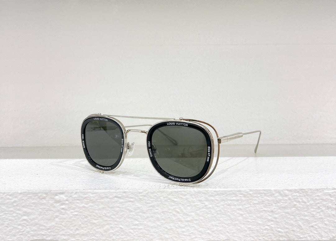 Gafas de sol negras, blancas y marrones