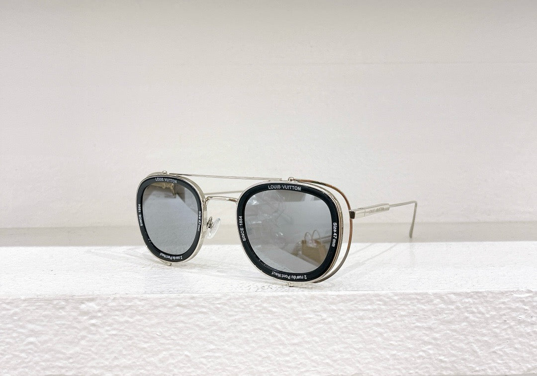 Gafas de sol negras, blancas y marrones