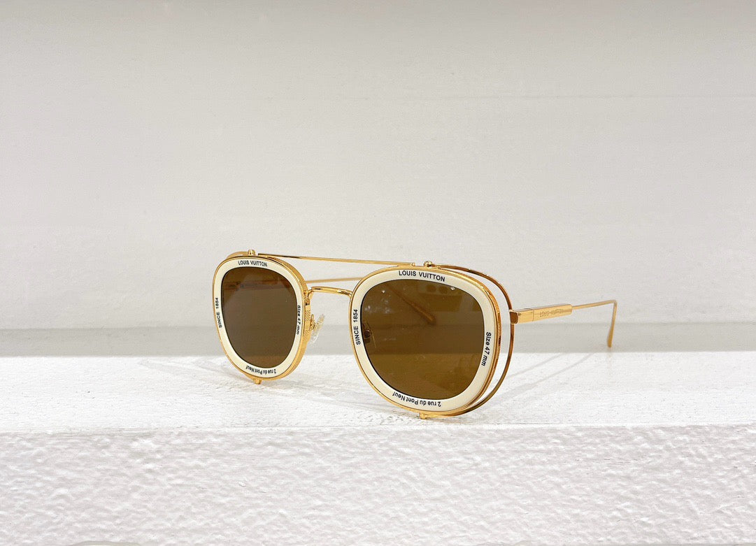 Gafas de sol negras, blancas y marrones