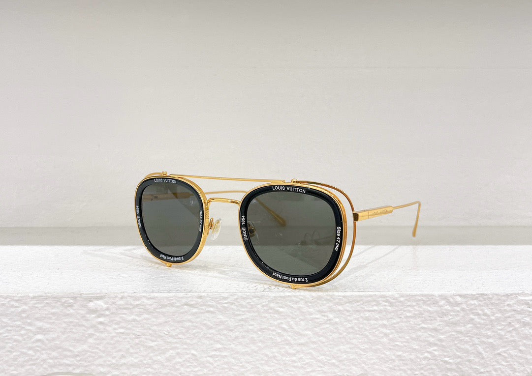 Gafas de sol negras, blancas y marrones