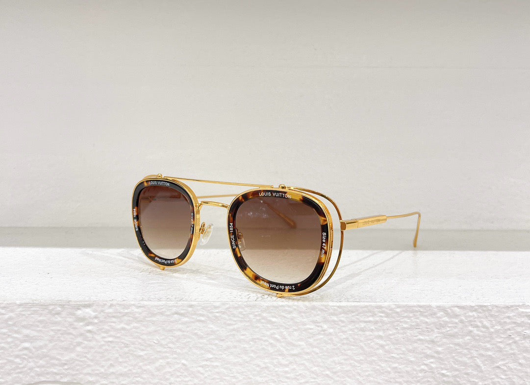 Gafas de sol negras, blancas y marrones