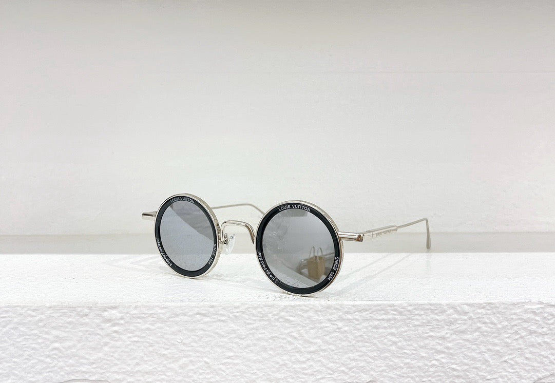 Gafas de sol doradas, marrones y negras