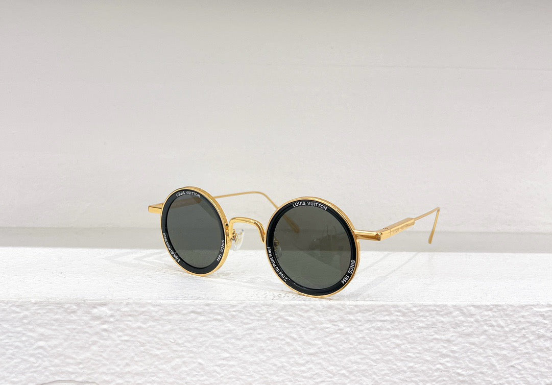 Gafas de sol doradas, marrones y negras