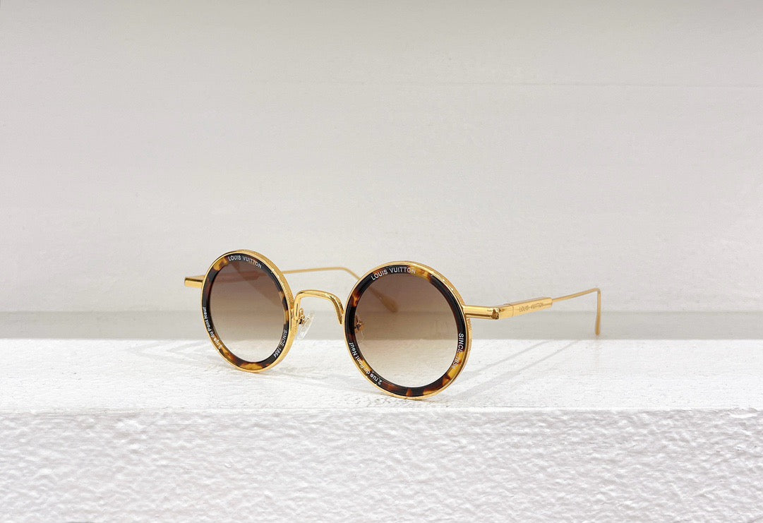 Gafas de sol doradas, marrones y negras