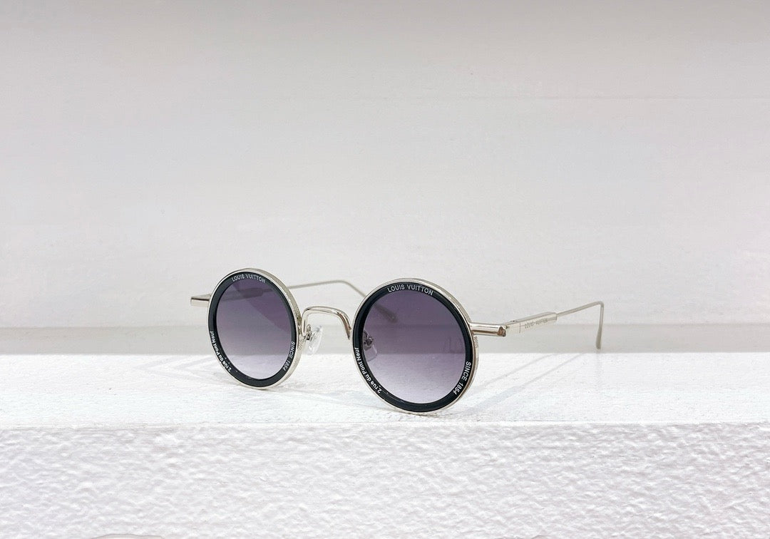 Gafas de sol doradas, marrones y negras