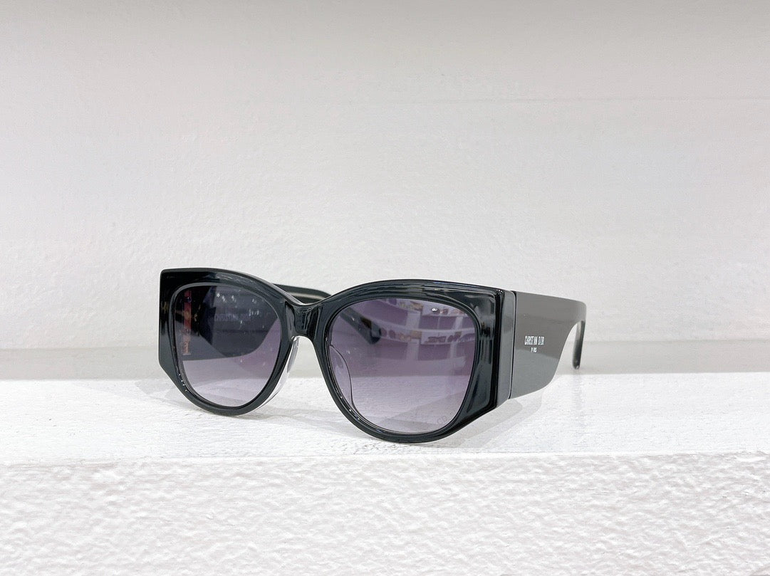 Schwarze, braune und weiße Sonnenbrille
