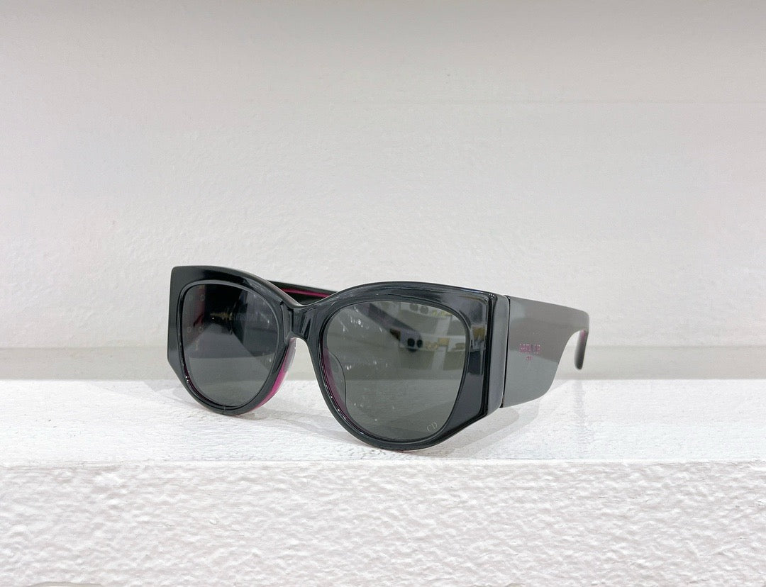 Schwarze, braune und weiße Sonnenbrille