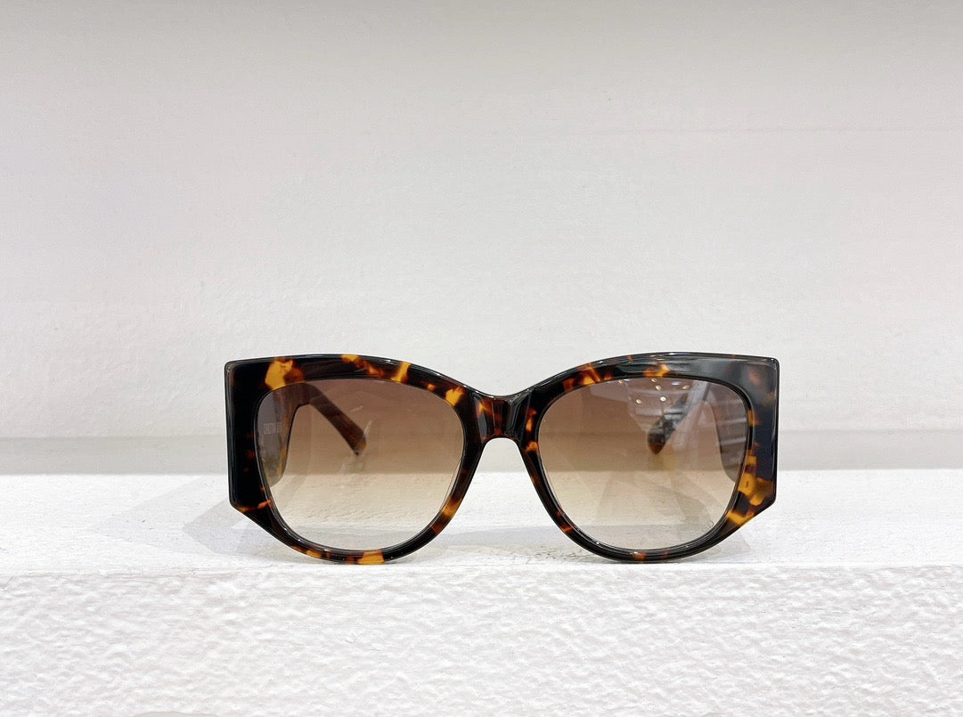 Schwarze, braune und weiße Sonnenbrille