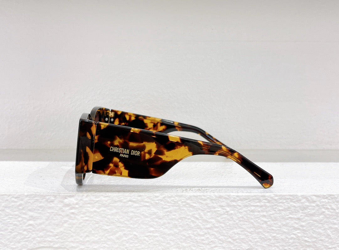 Schwarze, braune und weiße Sonnenbrille