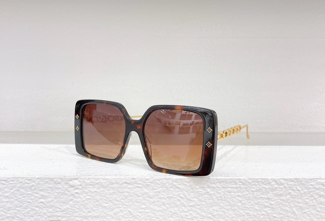 Gafas de sol negras, blancas, marrones y rosas