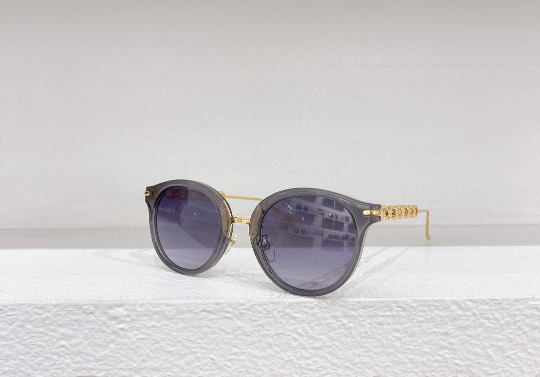 Gafas de sol negras, marrones, blancas y rosas