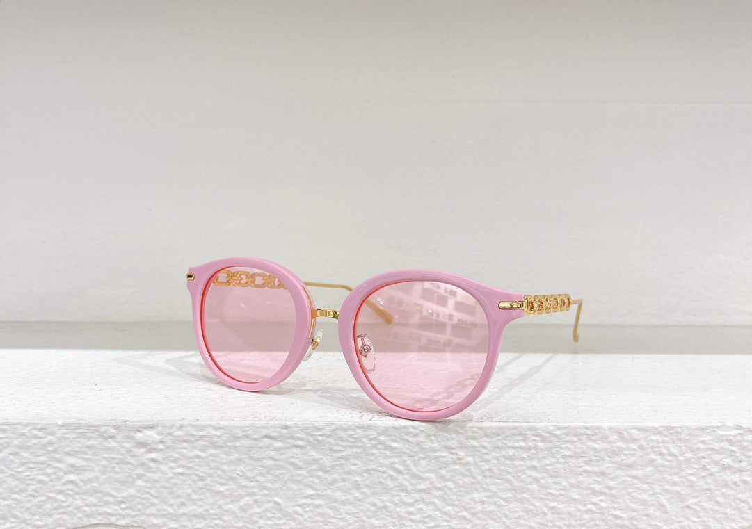 Gafas de sol negras, marrones, blancas y rosas