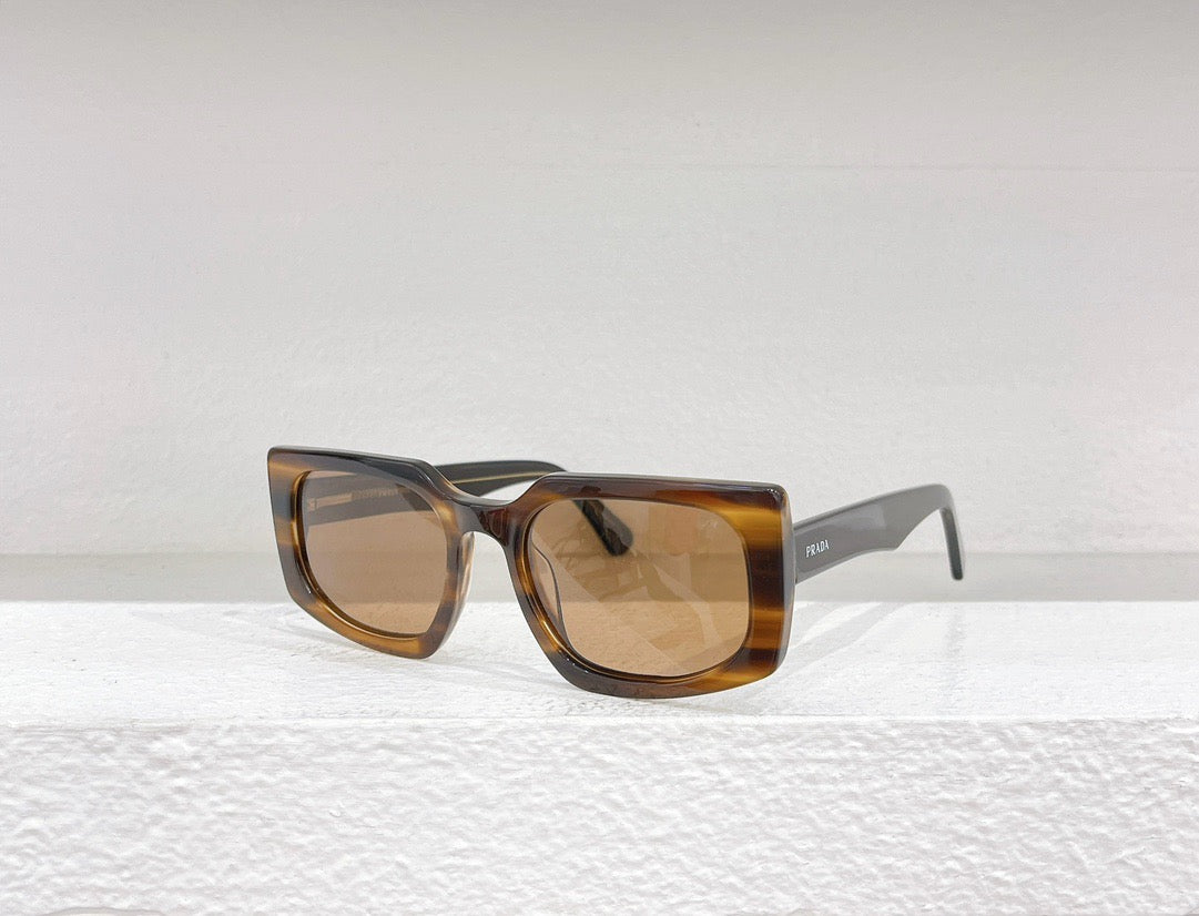 Gafas de sol negras, azules, marrones y grises