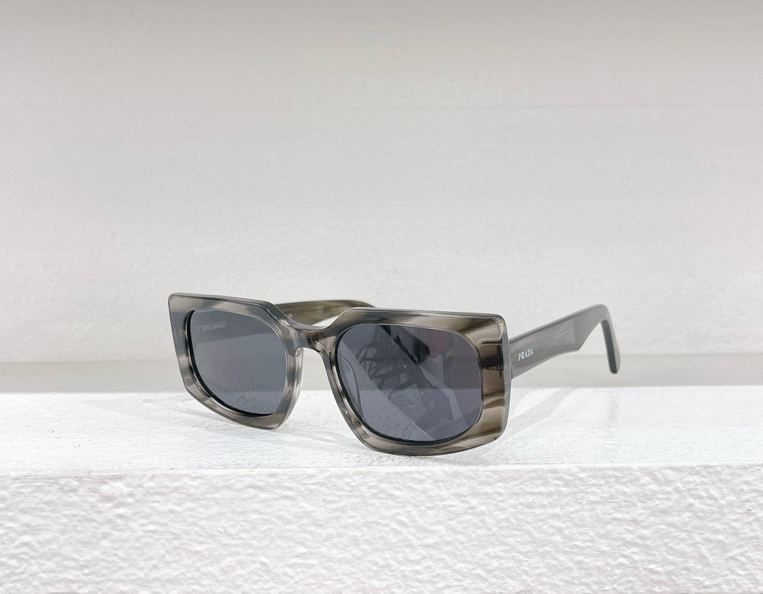 Gafas de sol negras, azules, marrones y grises