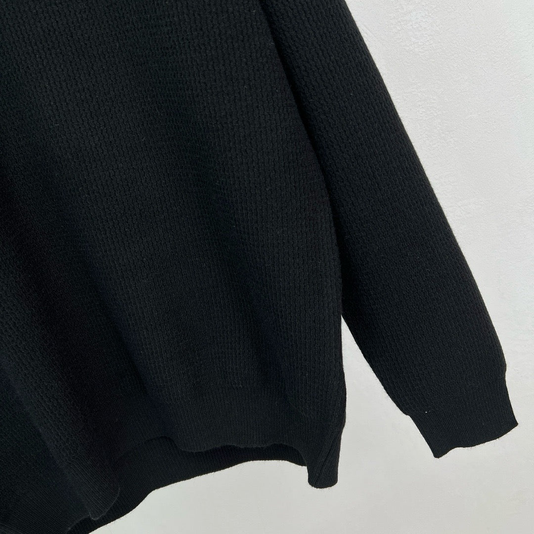 Jersey negro, gris y beige