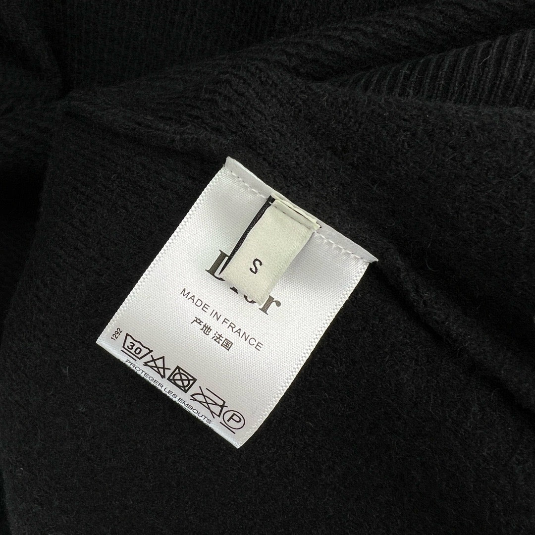 Jersey negro, gris y beige