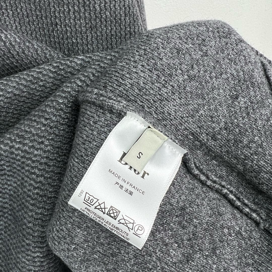 Jersey negro, gris y beige