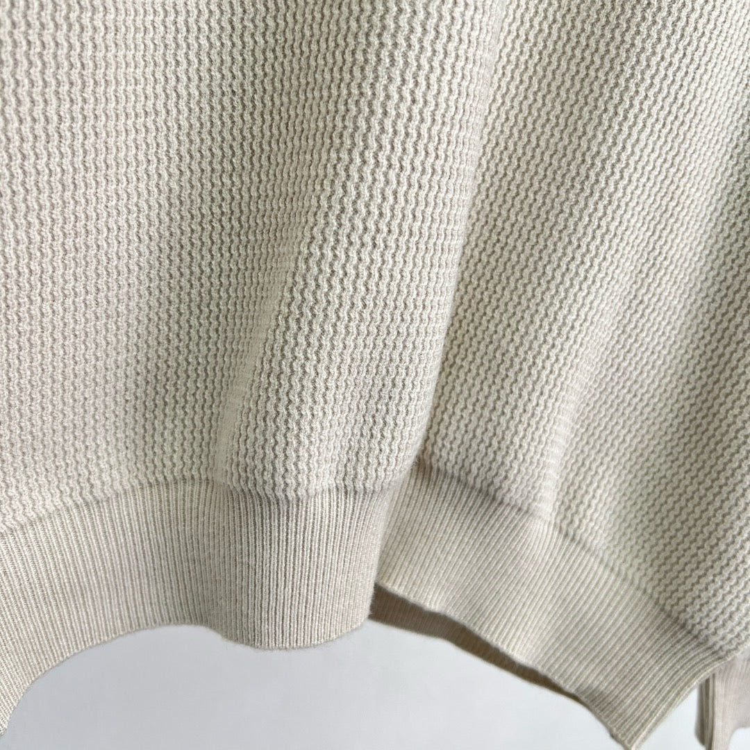 Jersey negro, gris y beige