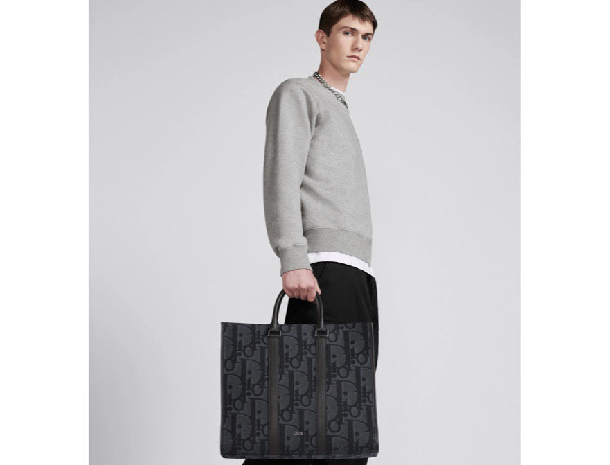 Blaue und schwarzgraue Tasche
