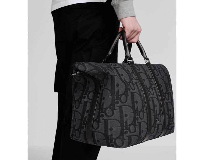 Blaue und schwarzgraue Tasche