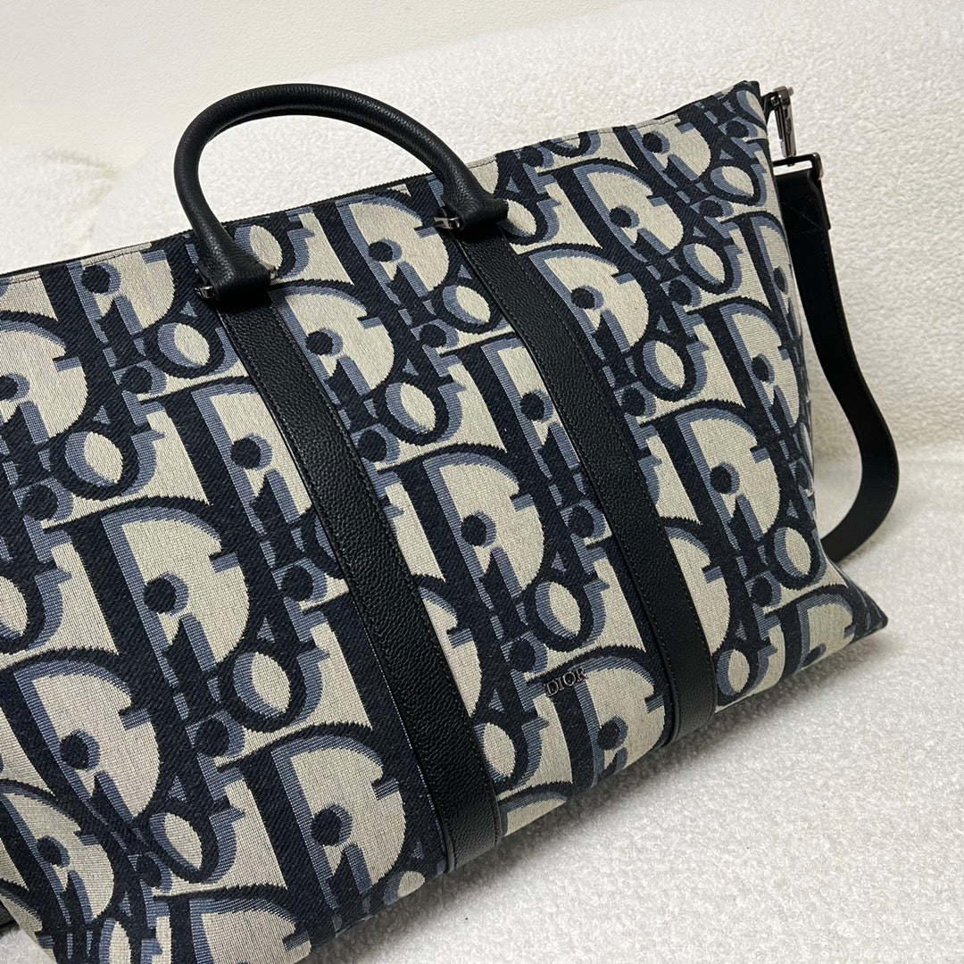Blaue und schwarzgraue Tasche