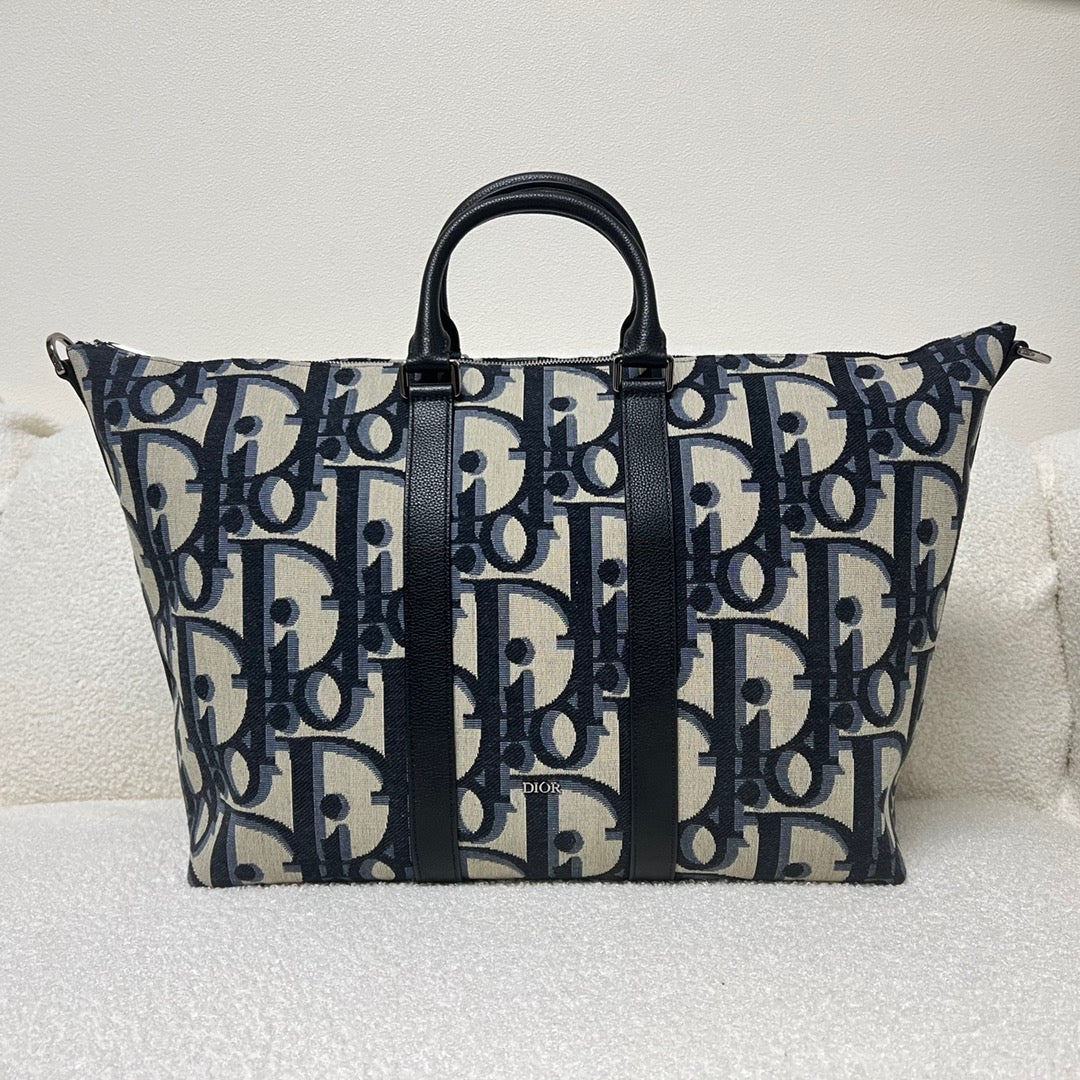 Blaue und schwarzgraue Tasche