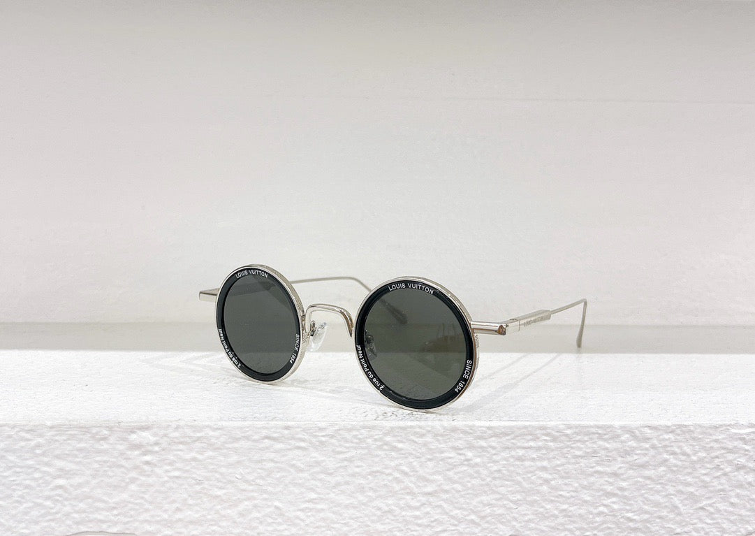 Gafas de sol doradas, marrones y negras
