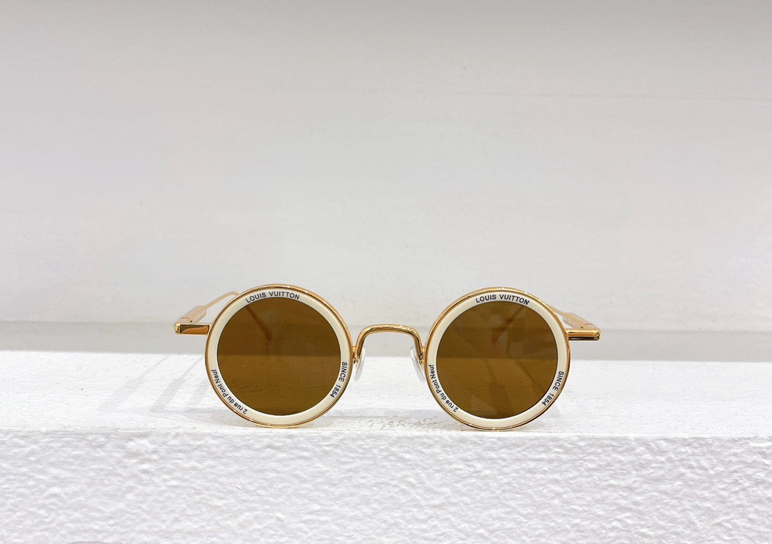 Gafas de sol doradas, marrones y negras