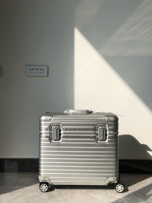 Silver and Black Suitcase