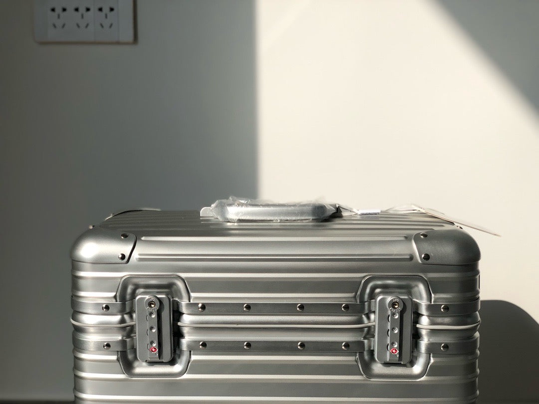 Silver and Black Suitcase