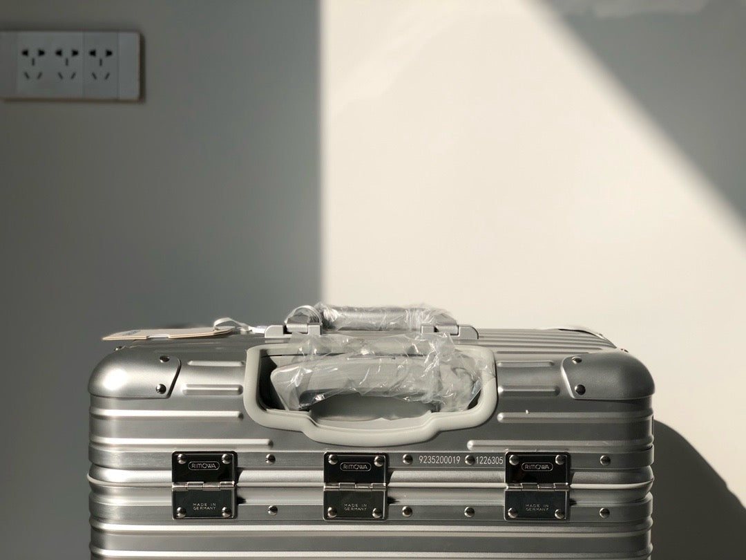 Silver and Black Suitcase