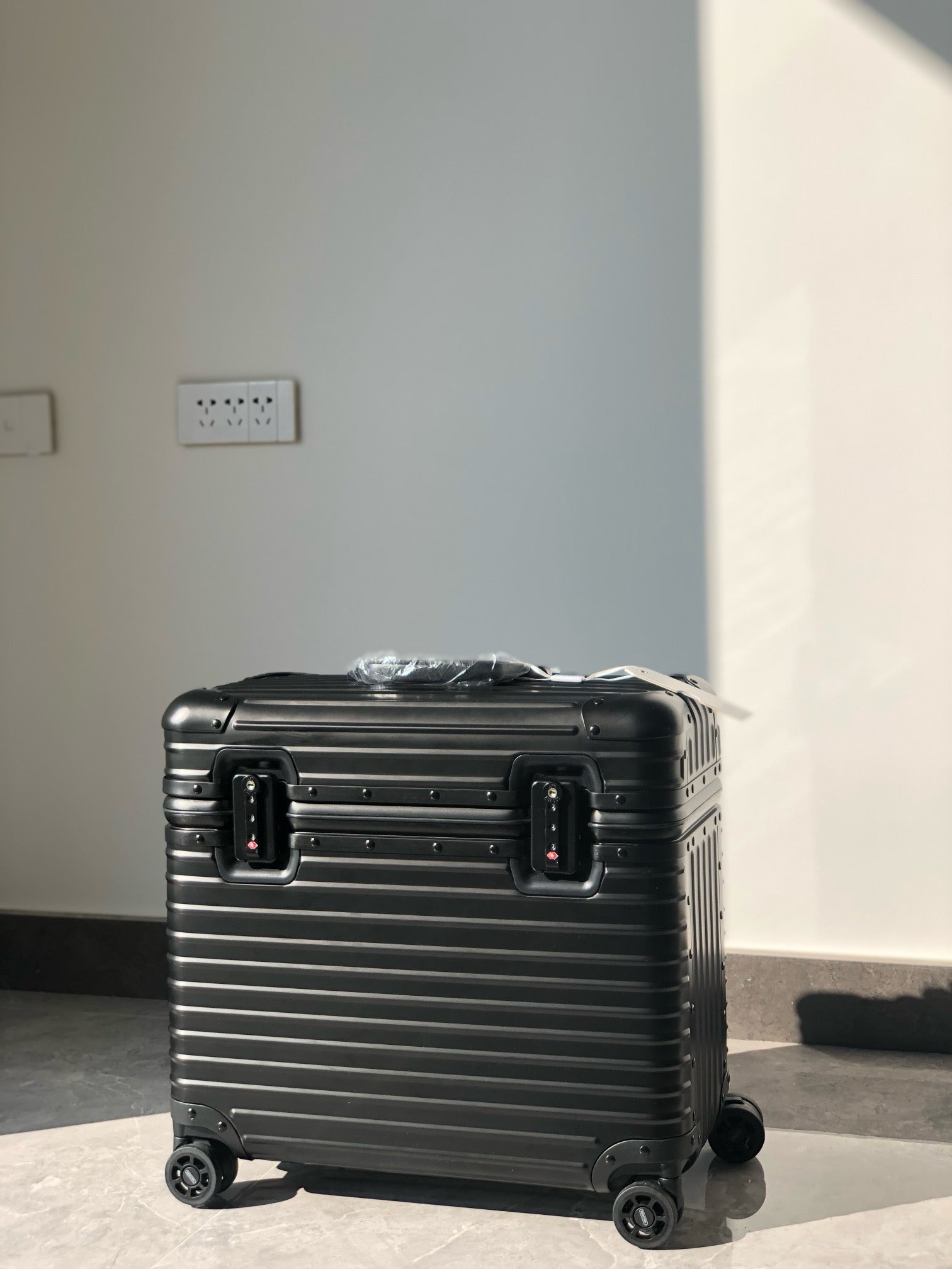 Silver and Black Suitcase