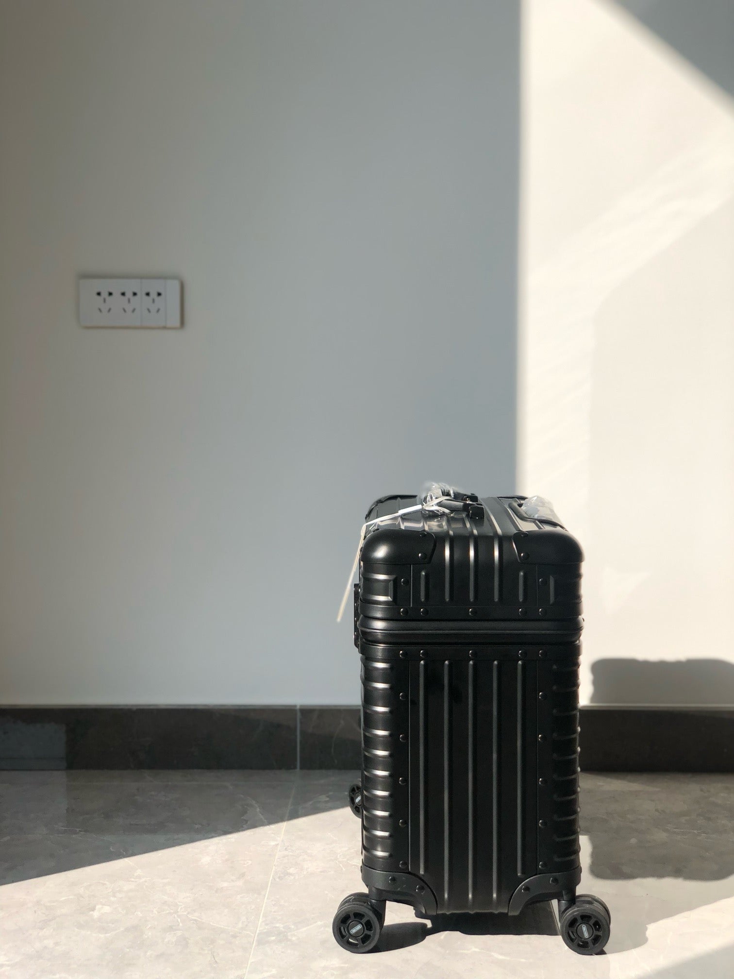 Silver and Black Suitcase