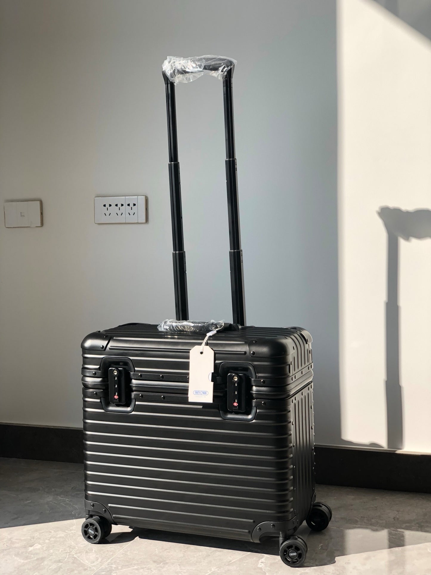 Silver and Black Suitcase