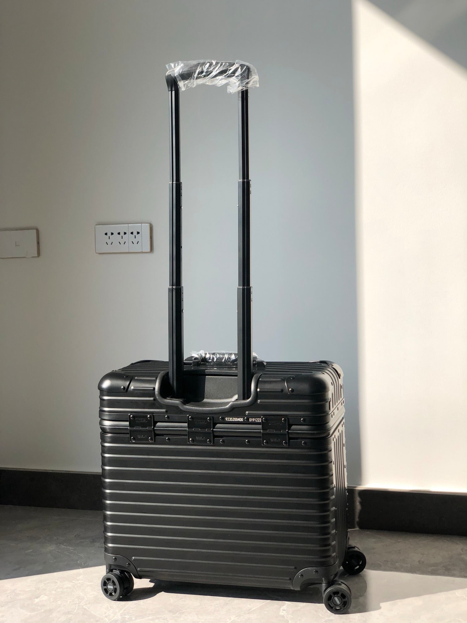Silver and Black Suitcase